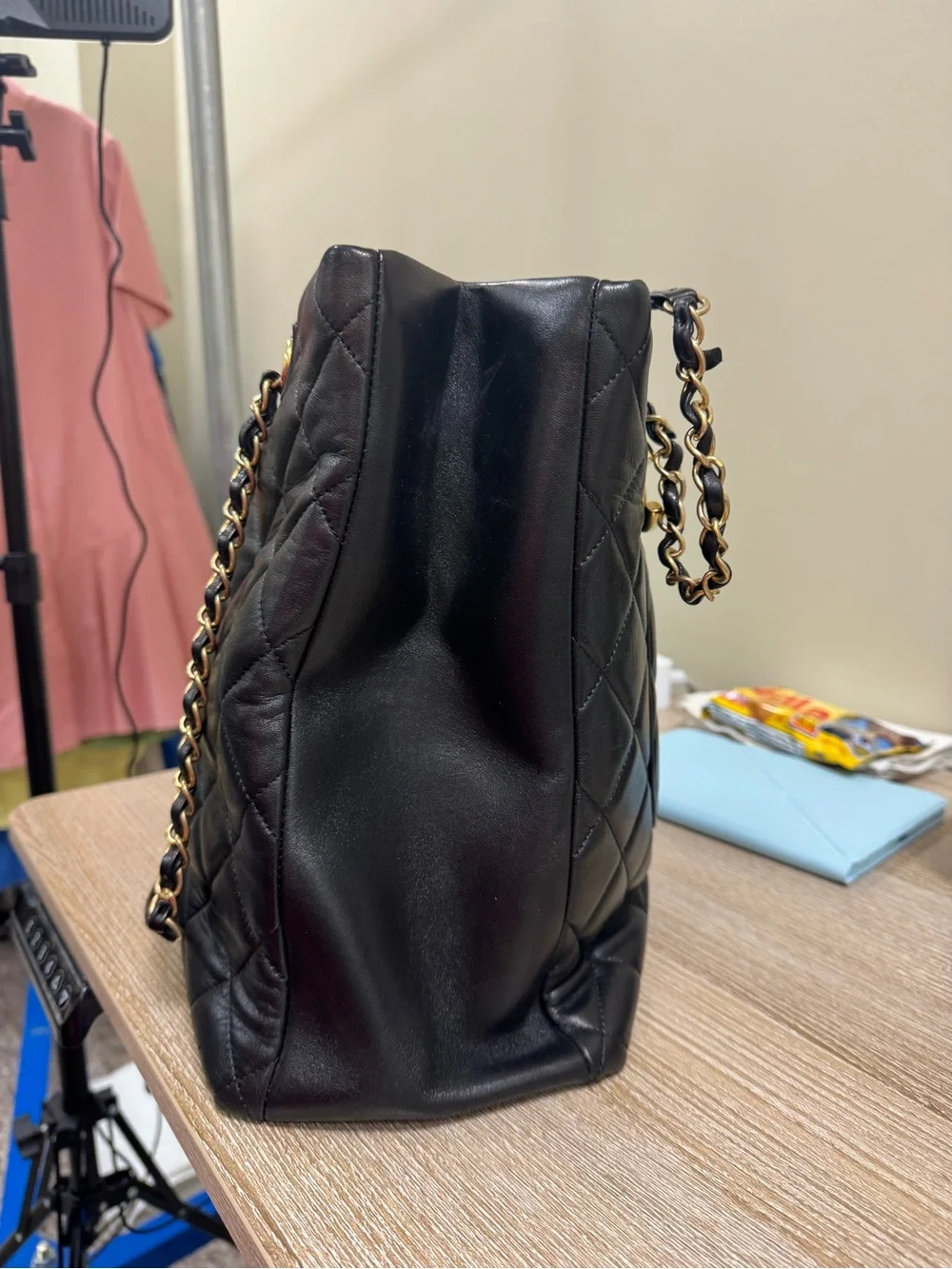 CHANEL Black Quilted Leather Shoulder Bag with Gold-Tone Plate and CC Charm
